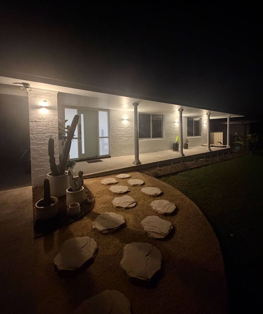 Front verandah of a house lit up at night