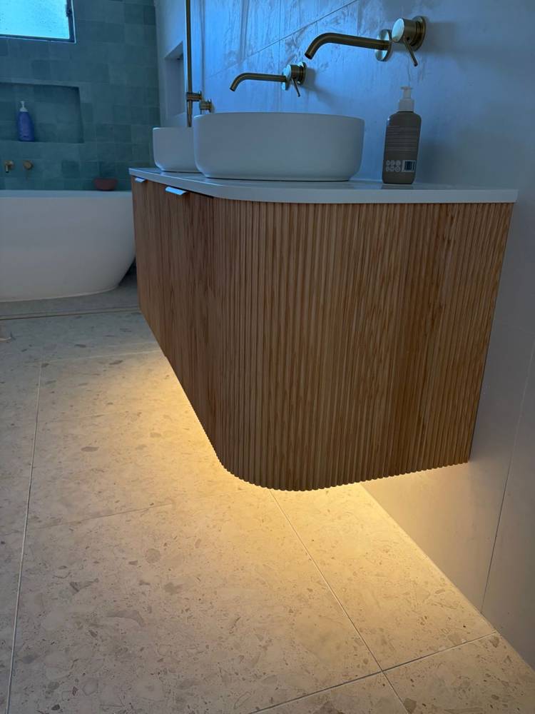 LED strip lighting under a floating timber vanity